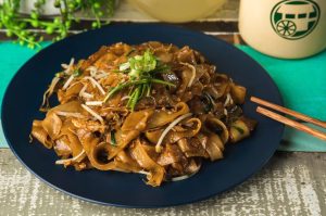 Malaysian stir fried flat noodles with choice of protein, eggs, fish cake (except Vegetable), bean sprouts and homemade soy sauce