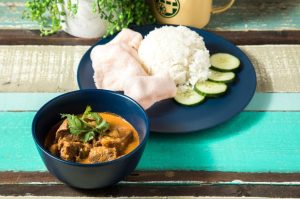 Caramelised boneless diced beef curry served with potatoes, prawn chips, cucumber and aromatic rice.